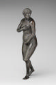 A bronze sculpture of a naked female figure. Her face has a look of shock on it, her head is tu…