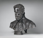 Alternate view of a bronze sculpture of Antonio Galli.  His eyes are facing straight ahead, he …