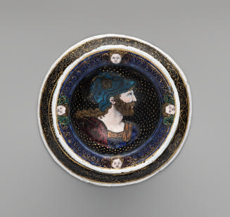 View from above of one of a pair of saltcellars made from polychrome enamel, showing the profil…