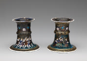 A pair of saltcellars made from polychrome enamel