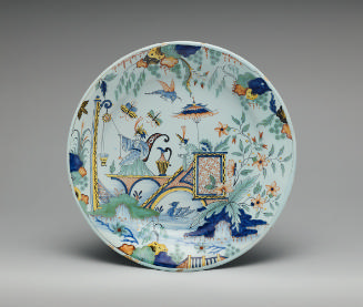 Circular plate with oriental scene in color
