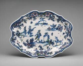 Large oval platter painted with figures, flowers and animals in color