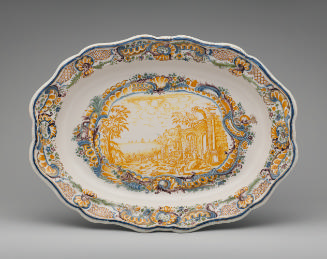Large oval platter with ruins in a landscape and an elaborate decorative border in color