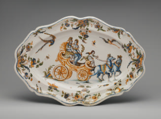 Large oval platter showing a chariot pulled by horses surrounded by floral decoration, in color