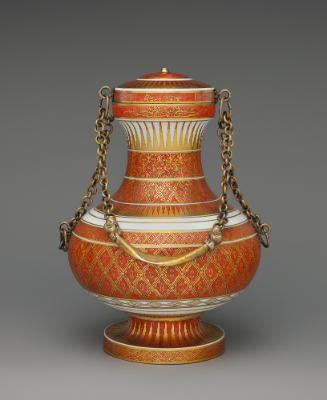 Red and gold porcelain vase with lid and gold chain