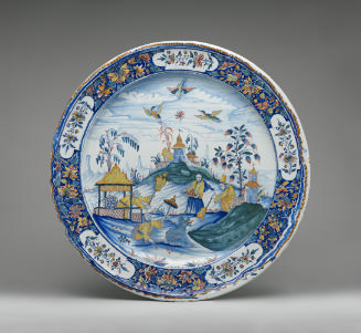 Large circular plate with a Chinese-inspired landscape and border, in color