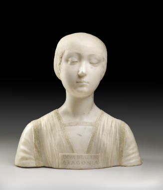 A marble bust of the Beatrice of Aragon.  Her hair is neatly wrapped behind her head, and her e…