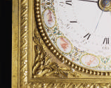 Detail of the bottom left corner of the enameled dial, showing three zodiac signs and a gilt br…