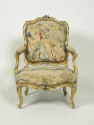 Front view of Armchair with Gilt and Polychrome Frame and Beauvais Tapestry Cover Showing Pasto…