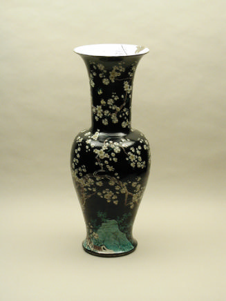 Black ground porcelain vase with branches and white flowers