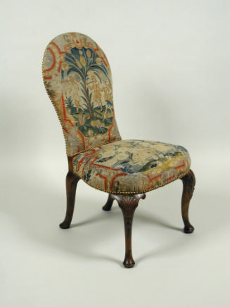 Chair with needlepoint upholstery showing three figures outside, with birds and floral motif