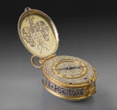Image of Silver gilt Pendant Clock opened to reveal the dial on the intricately carved body of …