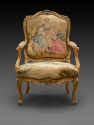 Front view of Armchair with Gilt and Polychrome Frame and Beauvais Tapestry Cover Showing Pasto…