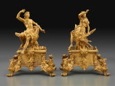 Pair of gilt bronze andiron with male and female figures seated on the back of an eagle, with s…