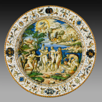 Ceramic dish representing in the middle a group of nude male and female figures against a count…
