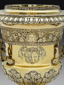 Detail of gilt silver wine cooler with branch handles and family crest