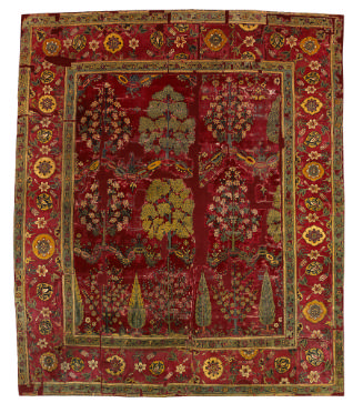 Dark red square Indian rug with design of trees and flowers