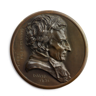 A bronze circular medal.  The sitter is L'Abbé de Lamennais, he is seen in profile from his rig…
