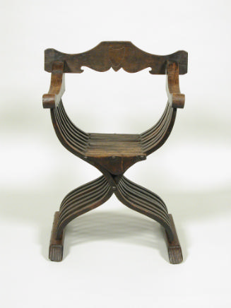 Walnut folding armchair with central shield