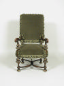 Photograph of green armchair from the front