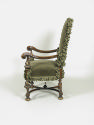 Photograph of green armchair from the side