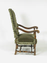 Photograph taken from the side of a green armchair