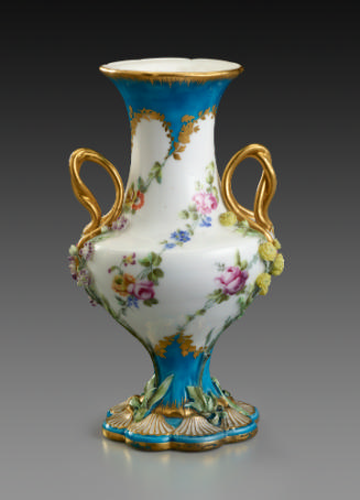 Porcelain vase in blue and white with gold handles