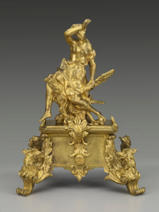 Gilt bronze andiron with female figure seated on the back of an eagle, with supports in the for…