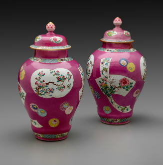 Pair of porcelain covered jars with famille rose decoration