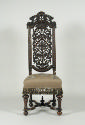 Alternate view of walnut chair with openwork back and embroidered seat showing flowers, fruit, …