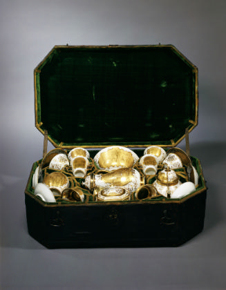 View of gilded white porcelain tea, coffee and chocolate service in its black leather case, the…