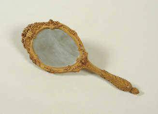 Maplewood hand mirror with carved decoration