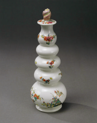 View of bottle vase with its stopper in white porcelain with floral motifs