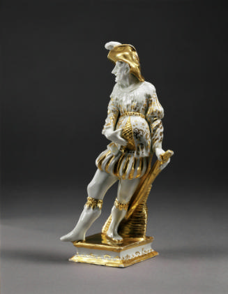 Image of a figure of an actor of the Commedia dell'Arte in white porcelain with gilding