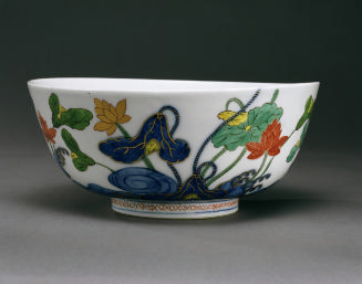 White porcelain bowl with flowers and vegetal motifs in blue, green and red glaze with gilding
