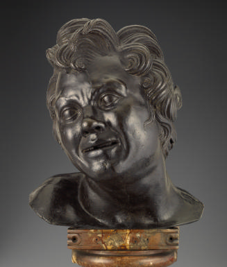 Bronze sculpture of a head of a faun.