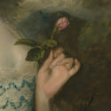 Close up of flower in oil painting of woman