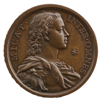 Bronze portrait medal of Prince Charles of England as young man, wearing classical-style armor …