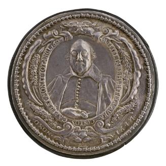 Silver portrait medal of Sir William Parkhurst framed by an ornate border of scrolls, bouquets …