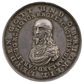 Silver portrait medal of King Charles I in armor, wearing a falling collar, jewel, and drapery …