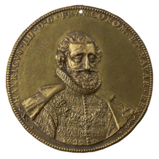 Bronze portrait medal of Henri IV wearing an embroidered doublet, a ruff at his neck, and an op…