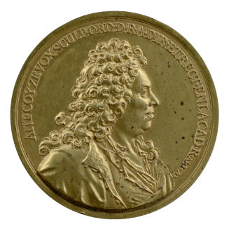 Gilt bronze medal of a man in profile to the right in a periwig tied with a ribbon, wearing an …