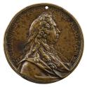 Bronze medal of a man in profile to the right wearing draped robes and a cravat