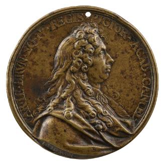 Bronze medal of a man in profile to the right wearing draped robes and a cravat