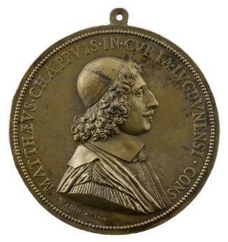 Bronze medal of a man in profile to the right with curled hair wearing a cap and magistrate’s r…