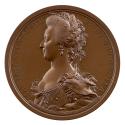 Bronze medal of a woman in profile to the left