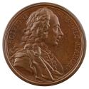 Bronze medal of a man in profile to the right