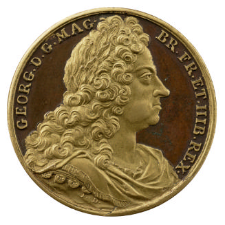 Partially gilt bronze medal of a man in profile to the right