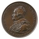 Bronze medal of a man in profile to the left wearing a fur-trimmed hat and robe