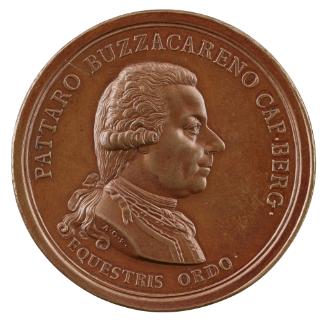 Bronze medal of a man in profile to the right